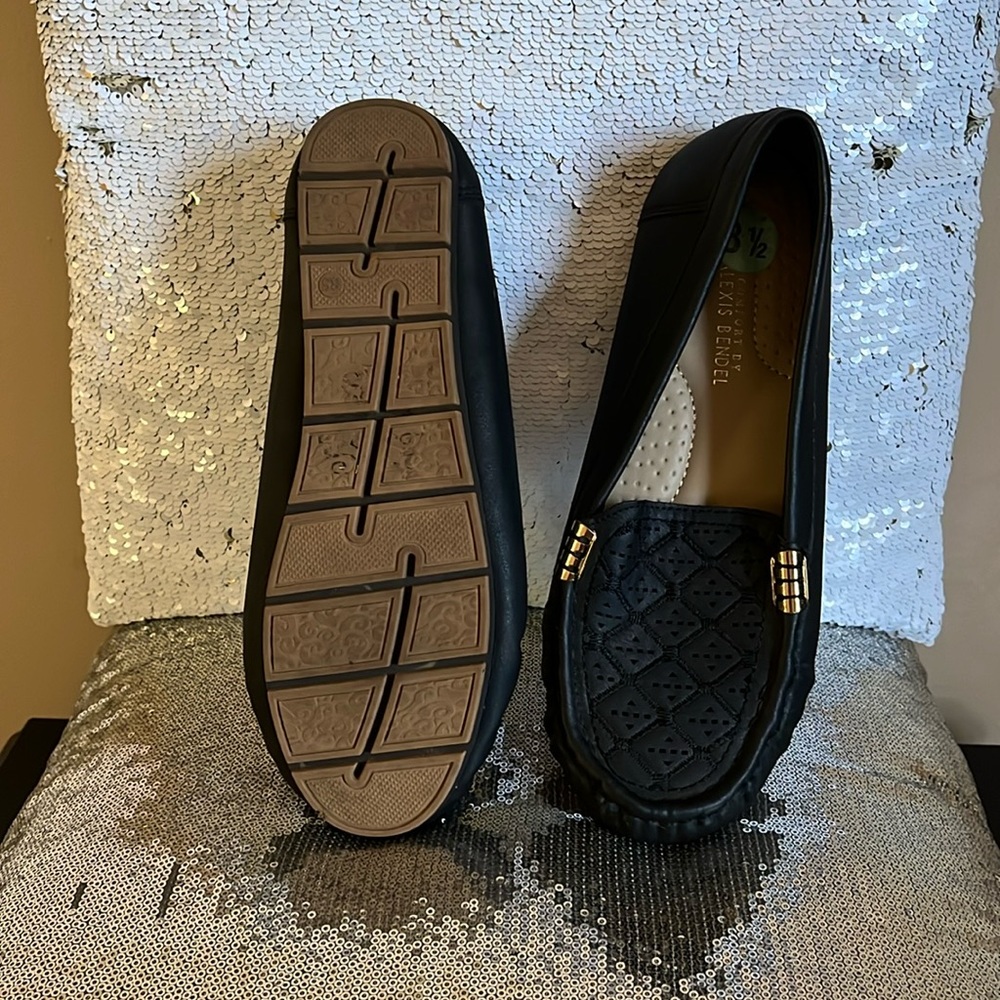 BLACK LOAFERS WITH GOLD BUCKLE ON EACH SIDE. WORN ONCE. AWESOME CONDITION.